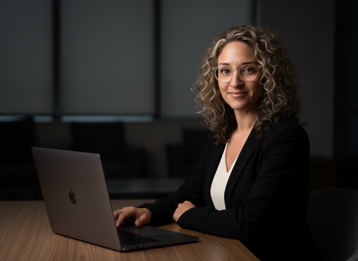 Dr. Johnna Richardson working at her laptop